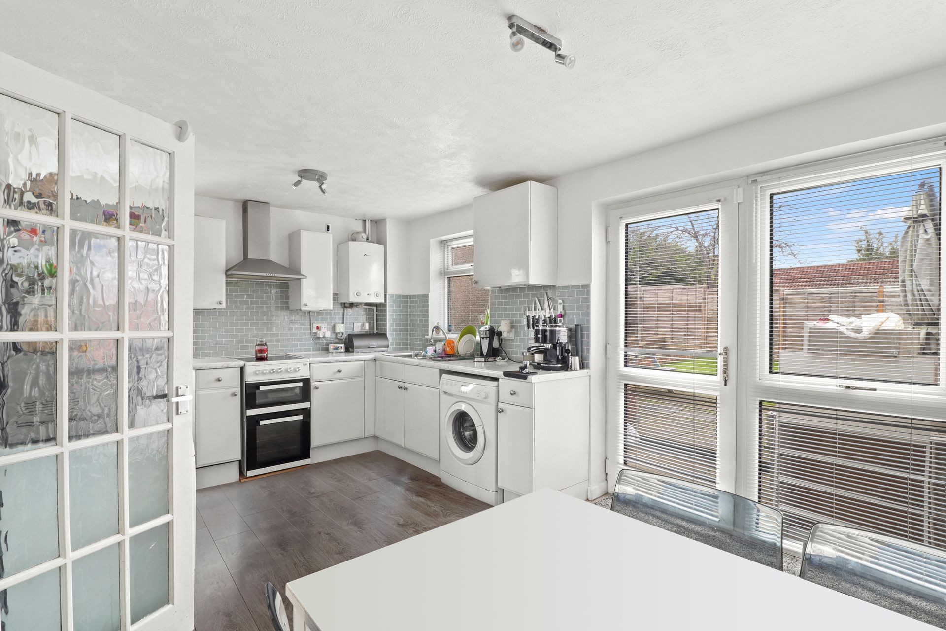 Small modern white kitchen of a rental property in Northamptonshire