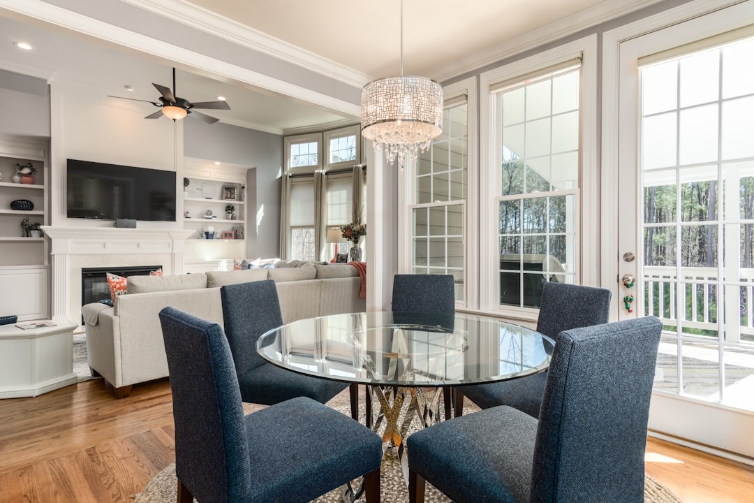 A modern medium-sized living room area with dining table and chairs